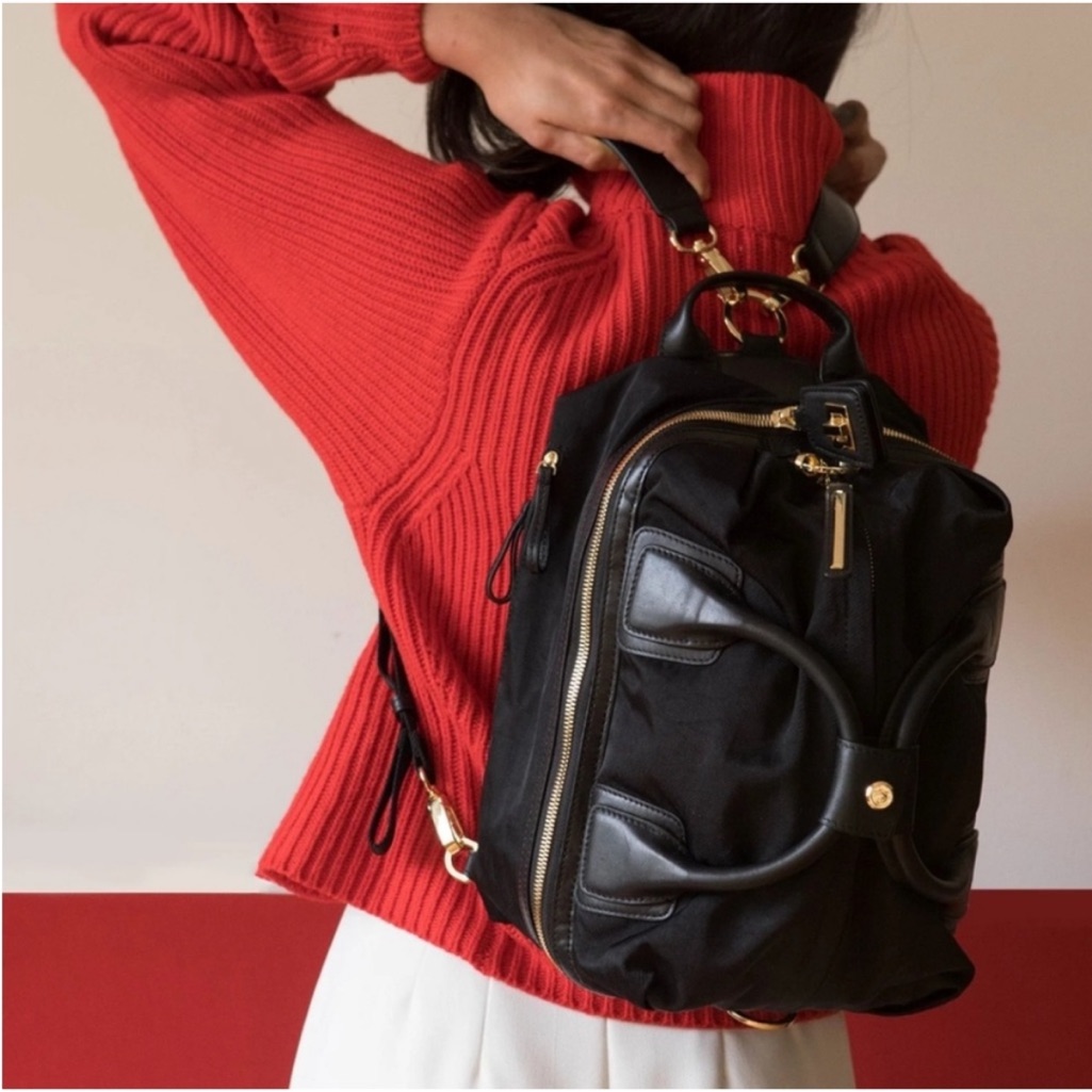 Blue Women's Convertible Backpack With Gold Accents